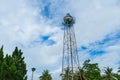 A water tank under blue sky