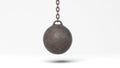 Metallic rusty wrecking ball on chain