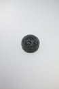metallic scrubber crafted from coiled stainless steel wire in a circular, isolated on a white background Royalty Free Stock Photo