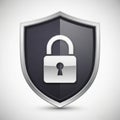 A metallic shield featuring a stylized padlock icon at its center. The shield is silver with Royalty Free Stock Photo