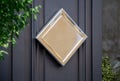 Metallic sign on hotel door mockup. Golden plate on storefront wall in street