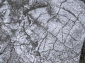 Metallic silver rough texture leaf foil background. Matte gray abstract textured stone with crack Royalty Free Stock Photo