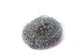 Metallic sponge for dishes on white isolated background..