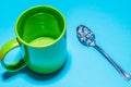 Spoon and cup with microplastics Royalty Free Stock Photo