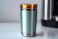 Metallic thermo cup with warm beverages, stainless steel container concept Royalty Free Stock Photo