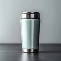 Metallic thermo cup with warm beverages, stainless steel container concept Royalty Free Stock Photo