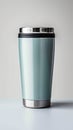 Metallic thermo cup with warm beverages, stainless steel container concept Royalty Free Stock Photo