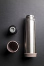 Metallic thermos over black background presentation Royalty Free Stock Photo