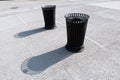 Metallic waste bins on a concrete surface Royalty Free Stock Photo