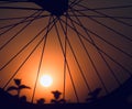 Metallic wheel spokes with afternoon sunlight background