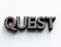 Metallic word \'QUEST\' with a shiny, textured surface on a white background.