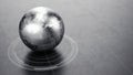 metallic World Globe on dark reflective surface Royalty Free Stock Photo