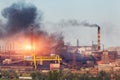 Metallurgy plant in Ukraine at sunset. Steel factory with smog