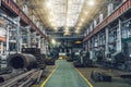 Metalwork factory with machines, lathes and steel pipes for processing metal production, industrial interior Royalty Free Stock Photo