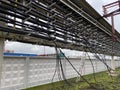 Metalwork of the farm of the pipeline through the air against the sky. The water supply system, heating, pneumomandrel environment Royalty Free Stock Photo