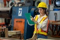 Metalwork manufacturing factory inspection with female engineer. Exemplifying