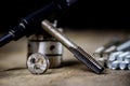 Metalwork tools on the workshop table. Threading dies and taps i Royalty Free Stock Photo