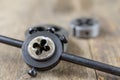 Metalwork tools on the workshop table. Threading dies and taps i Royalty Free Stock Photo