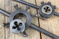 Metalwork tools on the workshop table. Threading dies and taps i Royalty Free Stock Photo