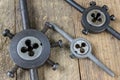 Metalwork tools on the workshop table. Threading dies and taps i Royalty Free Stock Photo