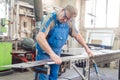 Metalworker man in his workshop working on project Royalty Free Stock Photo