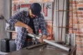 Metalworker tightening a bolt or clamp