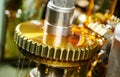 metalworking gear wheel machining with hob and oil lubrication Royalty Free Stock Photo