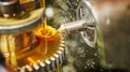 metalworking gear wheel machining with hob and oil lubrication Royalty Free Stock Photo