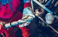 Metalworking Technician with Large Drill Bit in His Hands