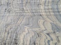 A metamorphic rock called gneiss creates pleasant patterns along its surface. Full screen, Royalty Free Stock Photo