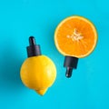 Metaphor, bottle with serum, oil in citrus, orange, lemon. The concept of vitamin C in cosmetics and aromatherapy