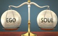 Metaphor of ego and soul staying in balance - showed as a metal scale with weights and labels ego and soul to symbolize balance