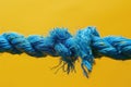 Metaphor for stress or challenge, a blue rope fraying in the middle. Royalty Free Stock Photo