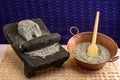 Metate with blue corn dough for making tortillas or masa atole, typical Mexican drink.