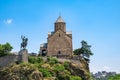Metekhi church and monument of King Vakhtang Gorgasali on cliff in Tbilisi, Georgia. Virgin Mary Assumption Church of Royalty Free Stock Photo