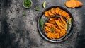 Metel tray with sweet potato fries with lime and herbs on dark background. Long banner format. top view Royalty Free Stock Photo