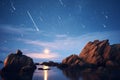 meteor shower over a rocky coastline at night Royalty Free Stock Photo