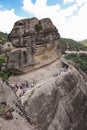 Meteora, Greece - 31 July, 2018: Tourists go to the Monastery of Varlaam of the Meteora Eastern Orthodox monasteries complex in Royalty Free Stock Photo