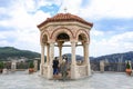 Meteora, Greece - 31 July, 2018: Tourists take pictures of the bells in the Monastery of Varlaam of the Meteora Eastern Orthodox Royalty Free Stock Photo