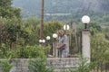 Meteora, Greece - September 19, 2018: Man working at backyards of village house