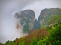 Meteora, Greece, winter dramatic landscape with heavy clouds and foggy mountains. Vibrant colorful nature Royalty Free Stock Photo