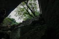 Meteora - Hiking trail through a cave near Holy Monasteries on cloudy foggy day in Kalambaka, Meteora, Thessaly, Greece