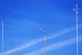 Meteorological instruments for measuring the wind speed, temperature and humidity on poles against a blue sky