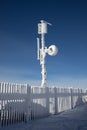 Meteorological Tower with measurement equipment, satellite dish, antenna. Royalty Free Stock Photo