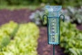 Meteorology with rain gauge in garden after the rain Royalty Free Stock Photo