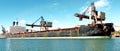 A 154 meter Bulk Carrier Ship loading at a Gladstone Harbour terminal. Queensland, Australia Royalty Free Stock Photo