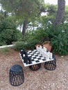 Meter by meter game ready big chess set in Mediterannean trees