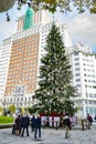 18-meter natural fir adorned with Christmas objects such as colored lights, sparkling balls and red gifts