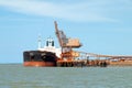 A 254 meter Ore Carrier Ship unloading Bauxite at Gladstone Harbour, Queensland, Australia Royalty Free Stock Photo