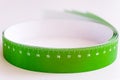 Meter tape for measuring rolled into a roll, on a light background. Selective focus Royalty Free Stock Photo